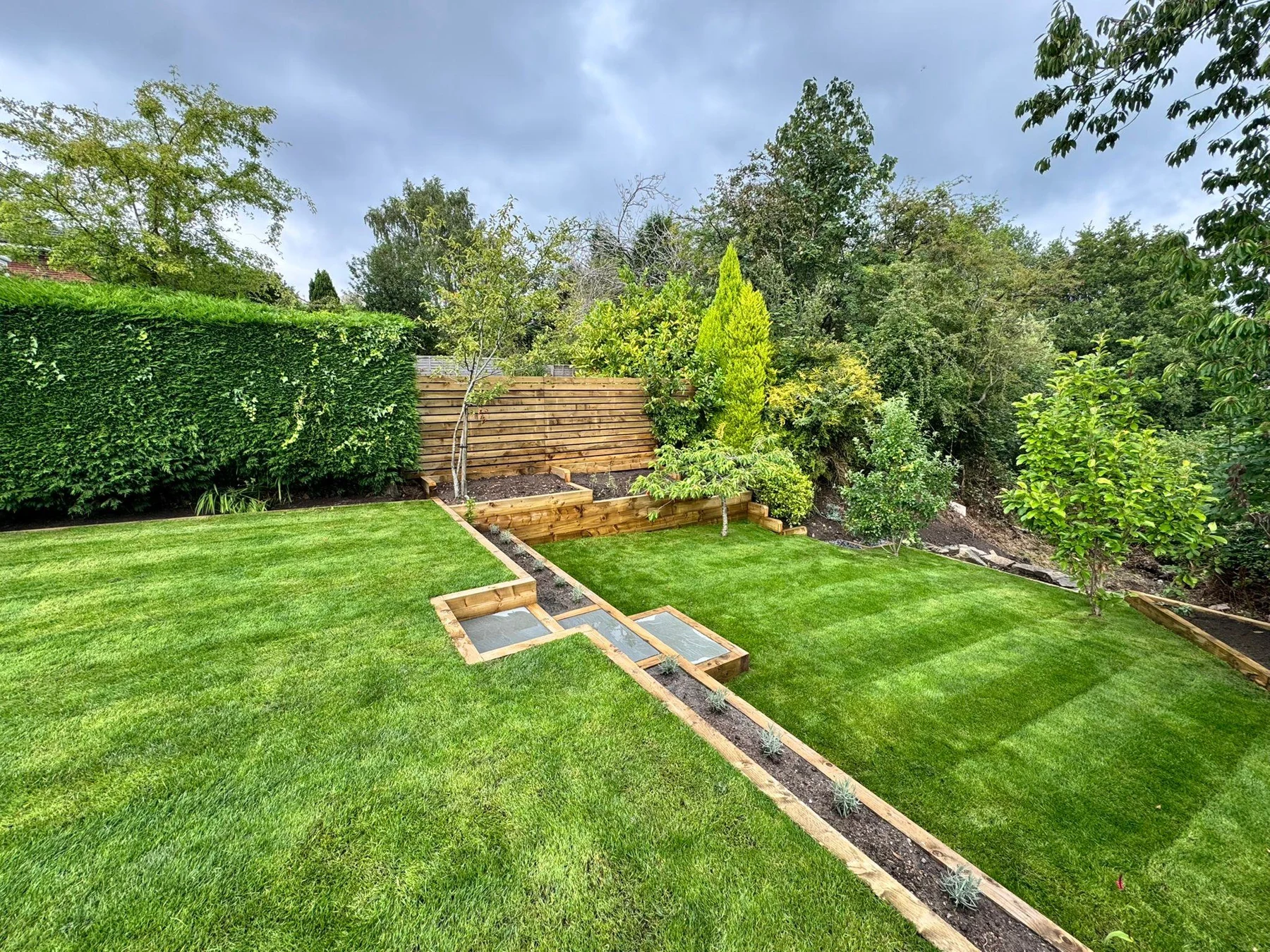 Garden transformation with a new lawn and stone steps